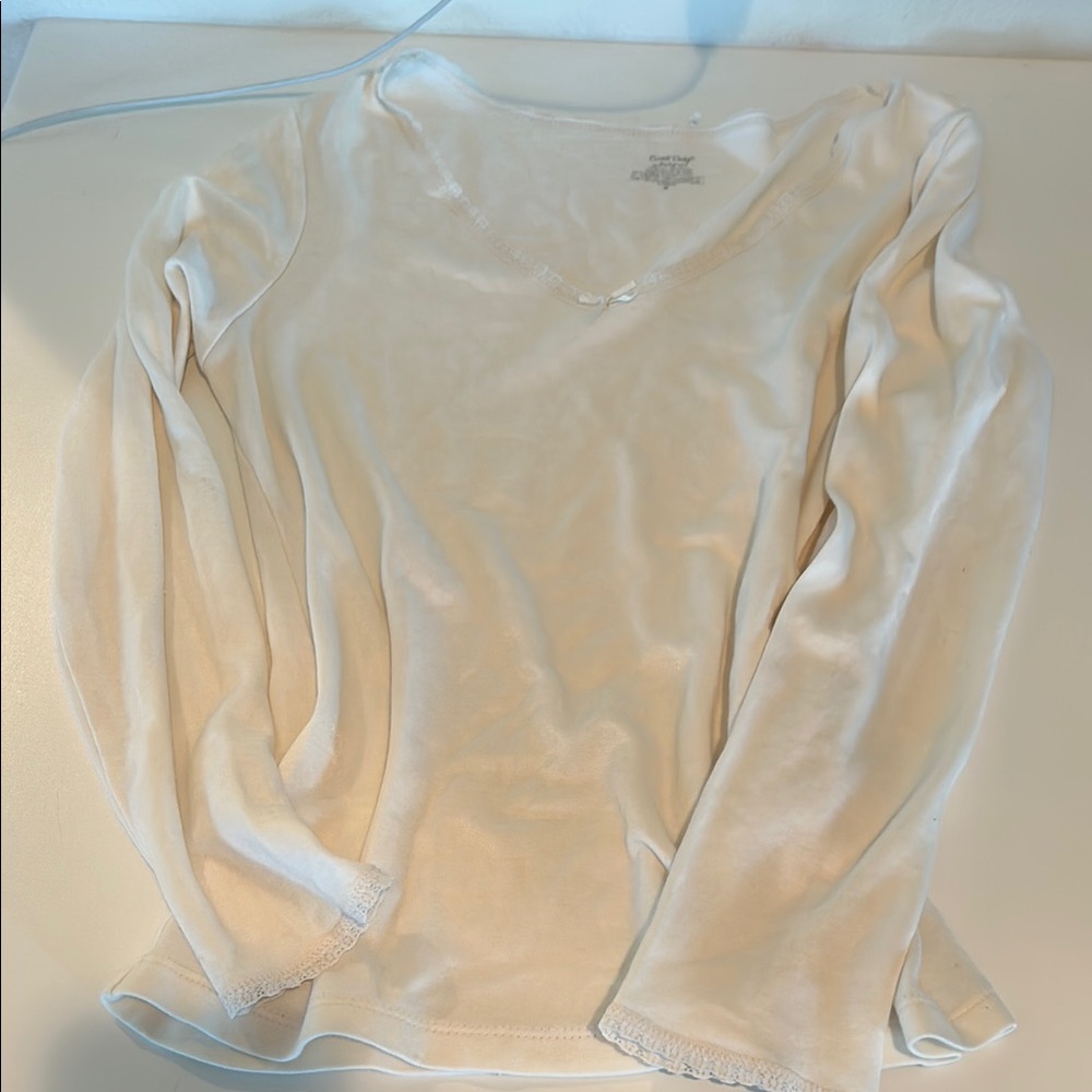 Cream Long Sleeve bow top with lace lined neckline and sleeves